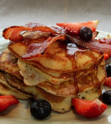 US Pancake Stack with crisp bacon, blueberries, strawberries & maple syrup