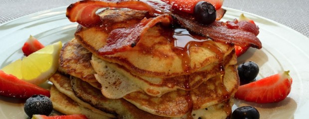 US Pancake Stack with crisp bacon, blueberries, strawberries & maple syrup